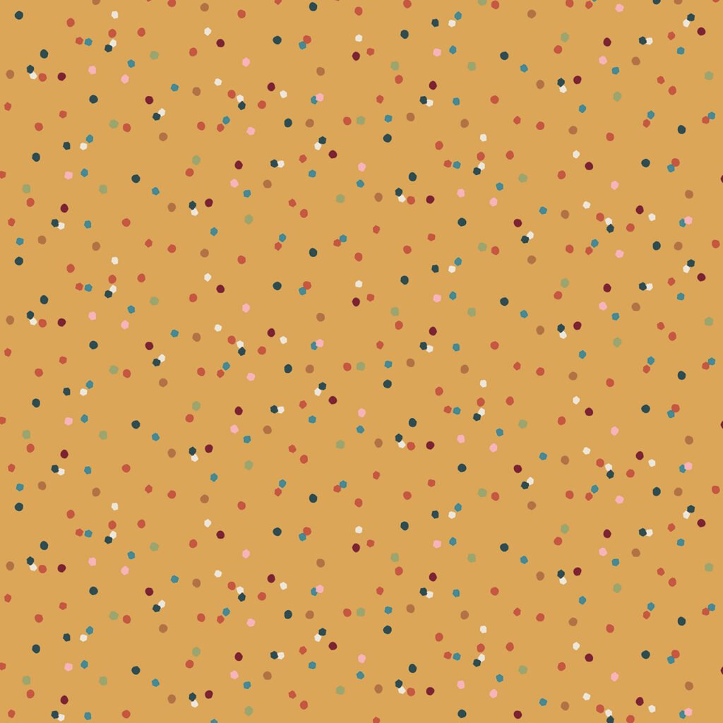 Surface pattern design featuring a warm gold background scattered with multicolored dots in shades of red, blue, pink, green, and white, creating a playful and vibrant aesthetic