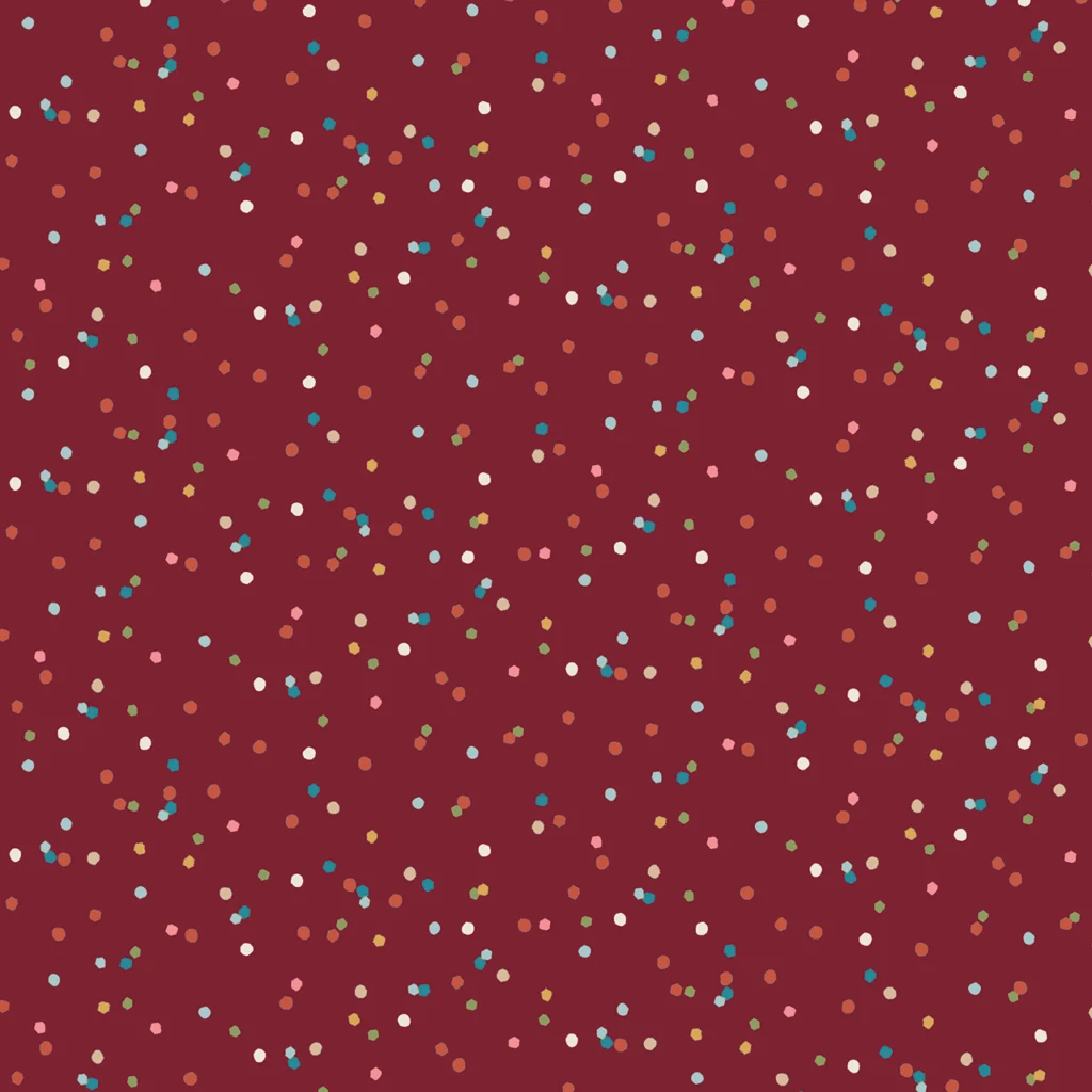 Red background with a playful pattern of scattered dots in a russet colour.