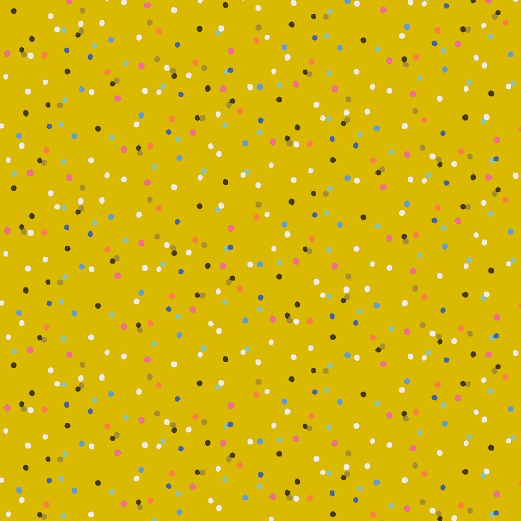 Yellow citrus coloured background with scattered coloured dots resulting in a confetti effect.