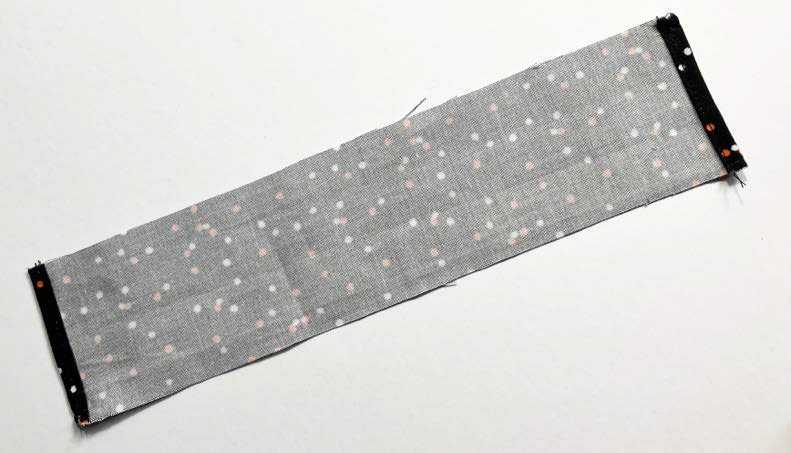 Folded fabric strip for drawstring channel