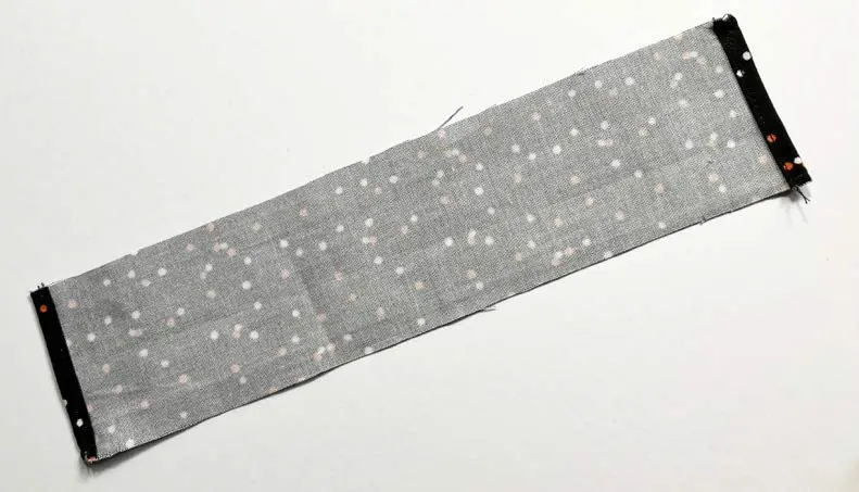 Folded fabric strip for drawstring channel