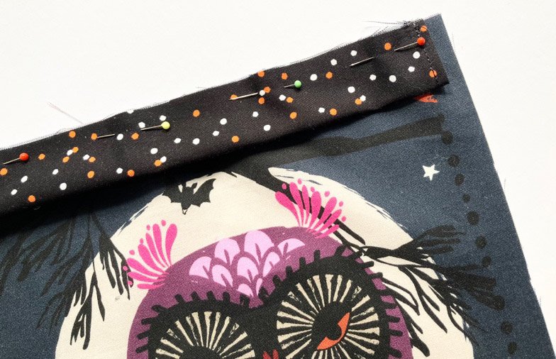 Drawstring channel sewn to the top of the fabric panel